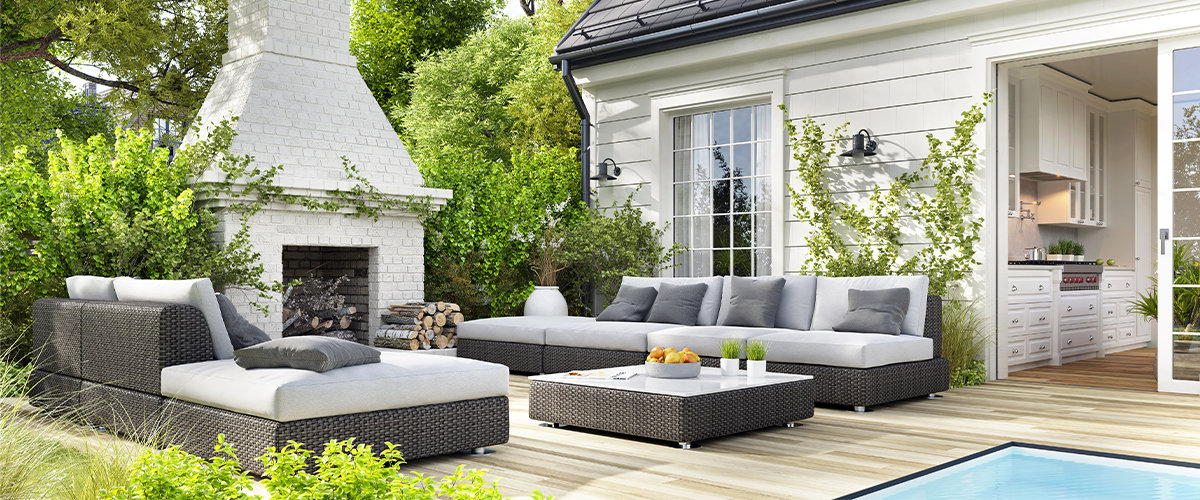Cozy patio area with garden furniture, swimming pool and outdoor fire place.